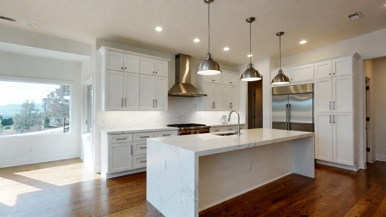 Luxury kitchen remodel with white cabinetry and marble island in Marin County